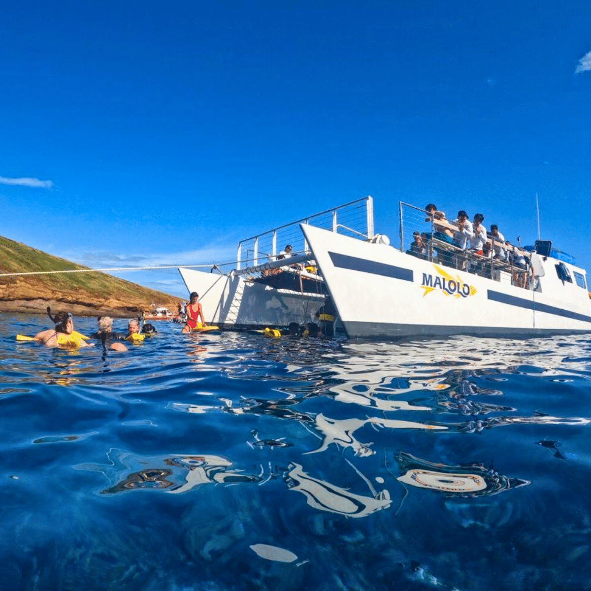 Malolo at Molokini with Snorkelers in the Water - Malolo Molokini and Turtle Town Snorkel Tour - Book Maui Activities with Auntie Snorkel